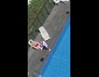 Man in brown top and red shorts lie down on the sunlounger