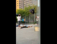 Group lays down on ground for video