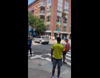 Men play soccer pass ball at intersection