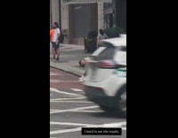 Woman sit on curb hold hair pose