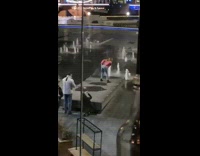 Girl pink cardigan hold butt fountain night