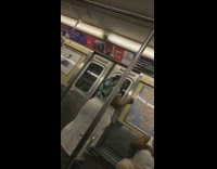 Pt. 3 Woman in blue green floral shirt applies hair relaxer on subway train