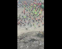 Lots of construction workers stretch together