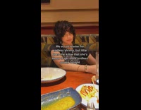 Guy at red lobster zooms in on girlfriend in black shirt 