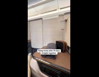 Man pulls divider between filmer inside plane