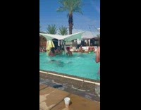 Guy swims under water hits on girl