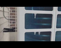 Small icicles sway on heat pump unit