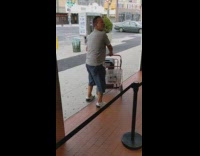 Grey shirt guy red dolly cart dances