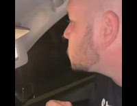 Guy uses mirror visor, driver hits the brakes, stops car and guy hits face in mirror