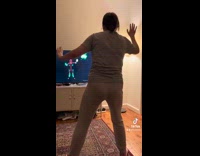 Baby falls in background woman just dance game 