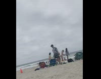 Five girls tiktok dance together beach overcast