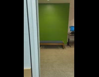 Smiley face on elevator door green wall