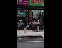 Woman vlogs and bumps man on sidewalk