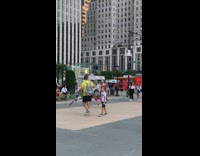 Woman maroon dress danced in the middle of the park