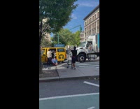 Truck honks at taxi stopped in middle of street