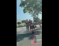 Group of women film a man and a woman to promote products on the cart