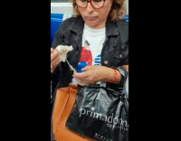 Woman black jacket knit while in train