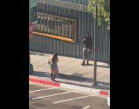 Collab IITW - Man shiny pants video shoot on sidewalk