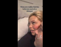 Parents and baby stare at each other