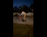 Guy rides hoverboard push friend in wheelchair