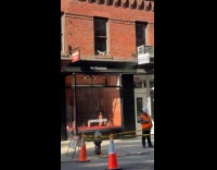 Cat paper mache decoration outside of window