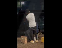 Man give haircut service under the bridge