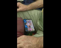 Guy watches video of ladies dancing on subway 