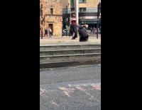 Collab IITW - Woman in masquerade dress poses at street