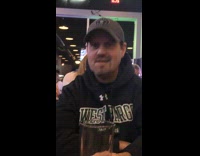 Guy makes repetitive noise restaurant black sweater