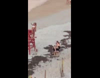Two girls red lifeguard chair friends shoulders