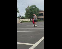 Little girl jumps onto skateboard with dad 