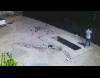 Guy paints wall steps back falls hole