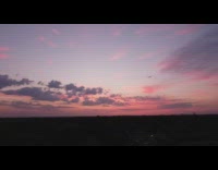 Drone video of the violet sunset sky in circle