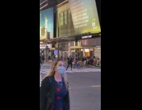 Woman black jacket aggressive pose pedestrian lane