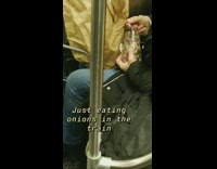 Man eats onions out of mason jar on subway train