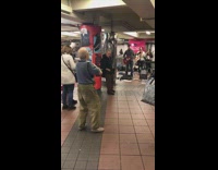 Grandpa and kid dance to subway performers 