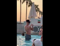 Collab IITW - Woman bikini with coconut juice at pool 