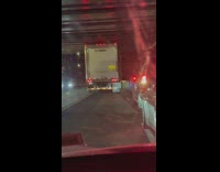 Truck blocking both lanes reversing on parkway