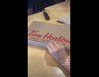 Person buy new pepperoni  pizza Tim Hortons
