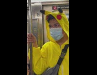 Guy in a pikachu one piece pajama 