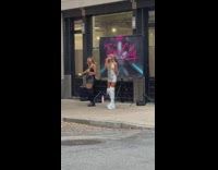 Two girls long boots sing street twin city