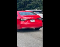 Collab WINY - Red car on road withrizz plate