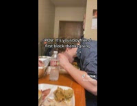 Guy eating plate face first next to girlfriend