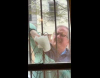 Dad wipe and clean outside of window