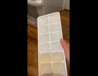 Ice cubes on tray with sparkly pattern