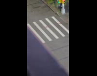 Man bikes around with tire on head