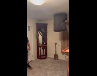 Friend holds cushion in air guy kicks it