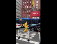 Collab WINY - Person wearing bob costume crossing the street