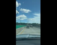 Thin tornado seen in the middle of the highway