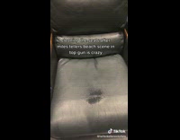 Guy black leather seat wet spot